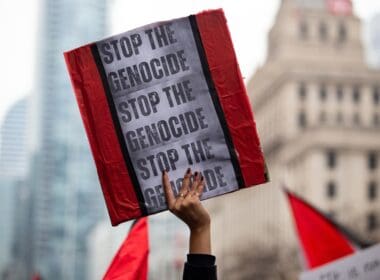 Person,holds,up,a,sign,saying,stop,the,genocide,at