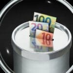 3d,illustration,,magnifying,glass,over,donation,box,with,euro,notes