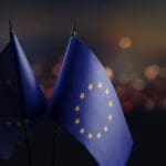 Small,national,flag,of,the,european,union,on,a,black