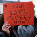 People,demonstrate,demanding,justice,and,accountability,for,the,fatal,train