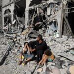 Palestinians,search,a,house,after,an,israeli,air,strike,,in