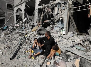 Palestinians,search,a,house,after,an,israeli,air,strike,,in