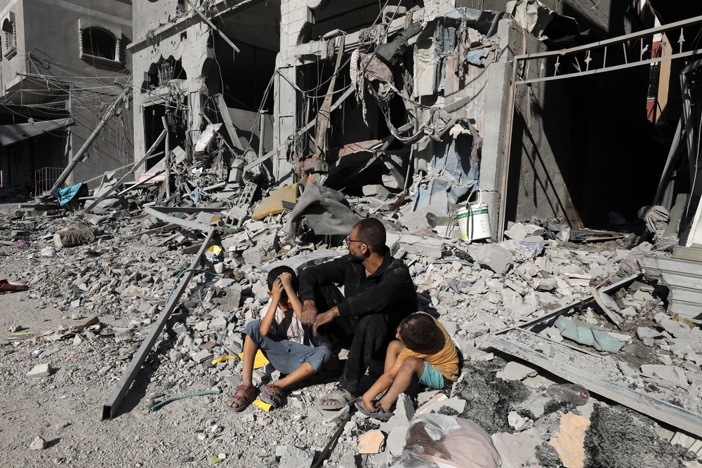 Palestinians,search,a,house,after,an,israeli,air,strike,,in