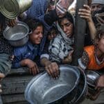 Displaced,palestinians,crowd,to,get,lentil,meals,from,(al takiya),due
