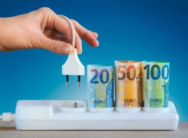 Hand,plugging,an,electric,cable,into,a,power, ,euro