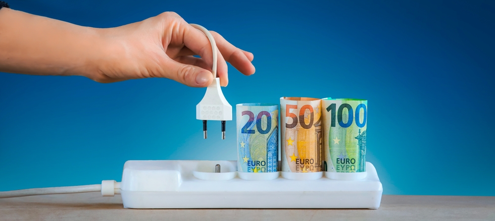 Hand,plugging,an,electric,cable,into,a,power, ,euro