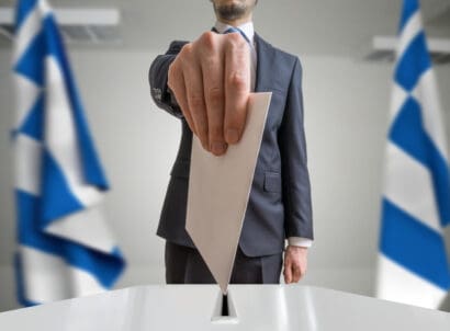 Election,or,referendum,in,greece ,voter,holds,envelope,in,hand