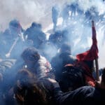 Demonstrators,clash,with,police,as,they,try,to,take,the