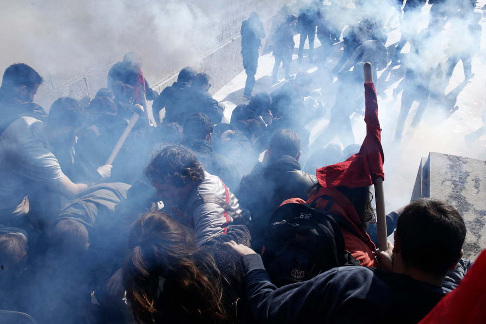 Demonstrators,clash,with,police,as,they,try,to,take,the