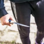 Close up,of,a,young,man's,hand,with,a,knife,,a