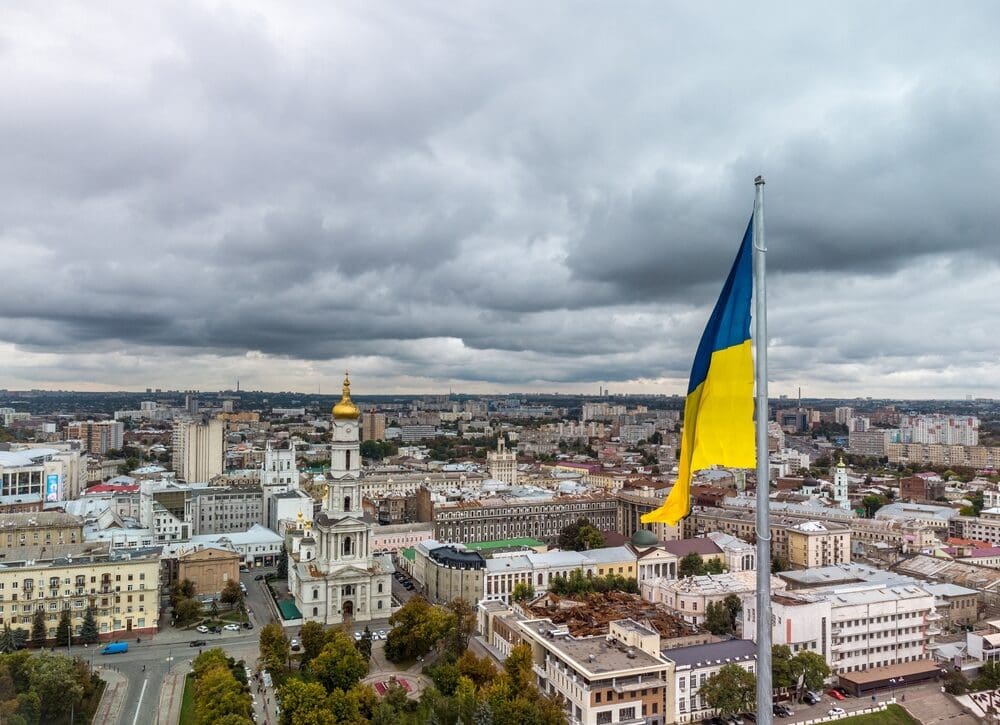 Flag,of,ukraine,close up,with,autumnal,epic,gray,cloudscape,,city