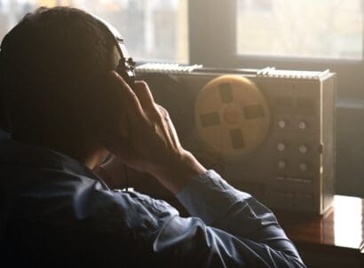 Secret,agent,listens,on,the,reel,tape,recorder ,officer,wiretapping