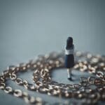 Chain,and,miniature,female,student,back,view