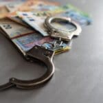 Handcuffs,and,euro,money ,economic,fraud