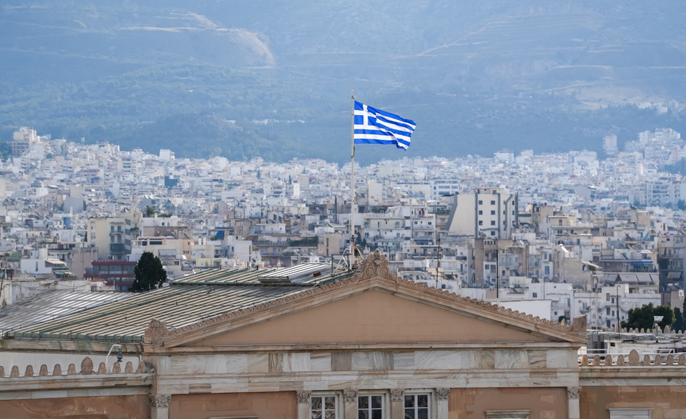 Flag,of,greece,waving,on,top,of,greek,parliament,during