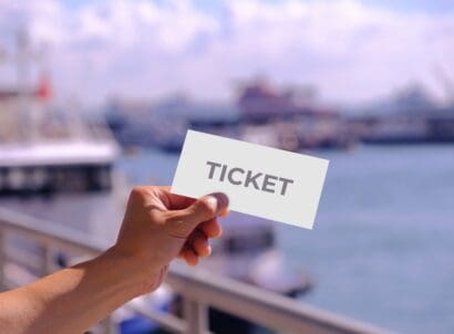 Hand,holding,blank,mockup,for,ticket,or,card,design,,at