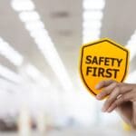 Hand,holding,safety,first,symbols,for,work,safety,,safety,first