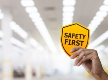 Hand,holding,safety,first,symbols,for,work,safety,,safety,first