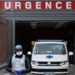 A,paramedic,walks,outside,the,cochin,hospital,in,paris,,france