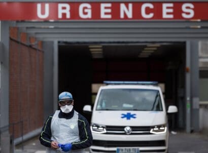 A,paramedic,walks,outside,the,cochin,hospital,in,paris,,france