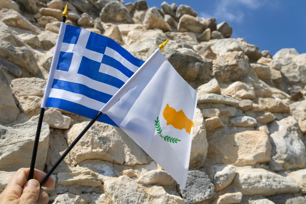 National,flags,of,cyprus,and,greece,in,hand,in,front
