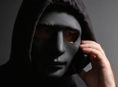 Robber,,a,man,in,a,mask,talking,on,the,phone,