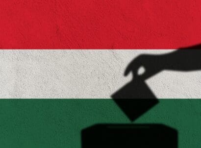 Silhouette,hand,election,vote,on,hungary,flag,wall,background