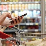 Side,view,close,up,of,woman,shopping,in,supermarket,and