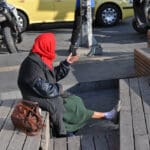 Homeless,beggar,woman,sitting,on,a,street,,athens,,greece