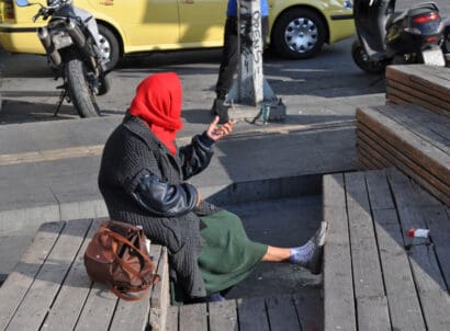 Homeless,beggar,woman,sitting,on,a,street,,athens,,greece