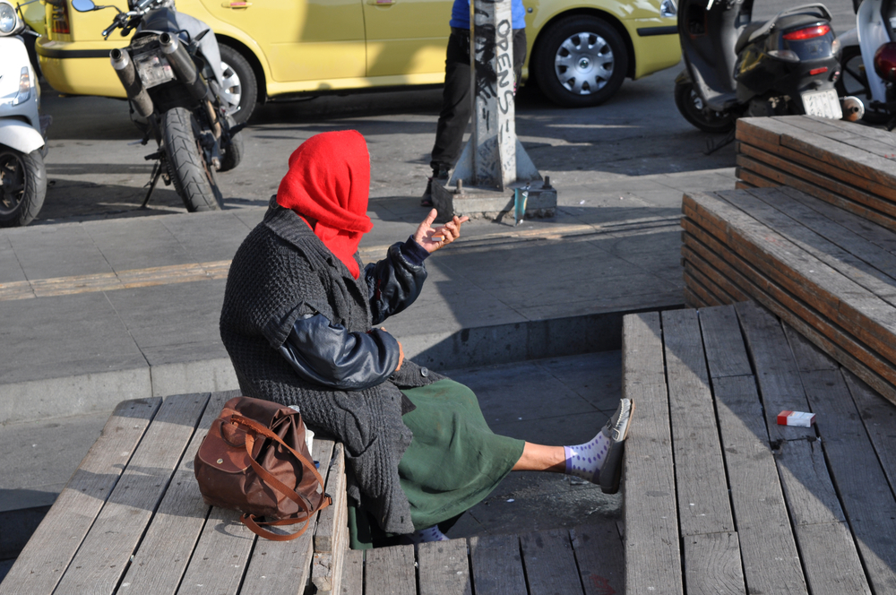 Homeless,beggar,woman,sitting,on,a,street,,athens,,greece